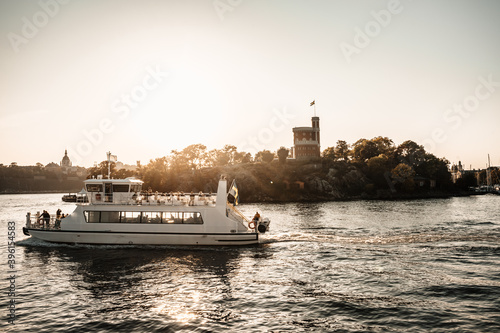 Canvas Print Stockholm commuter boat at sunset
