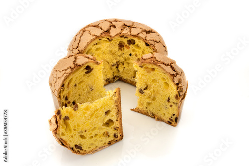 Panettone, classic Christmas Milan dessert with raisins and candied orange, sliced cake with three slices isolated on white