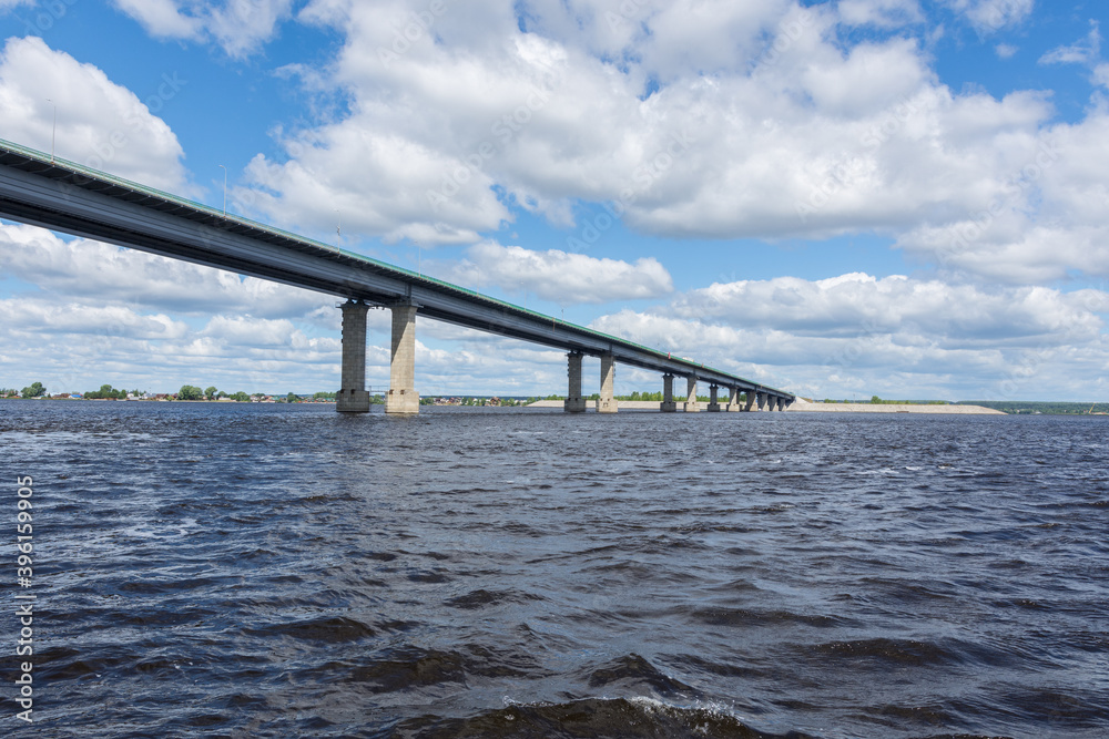 view of the Zaymishchensky bridge across the Volga, photo was taken on a sunny summer day, view from the Volga river