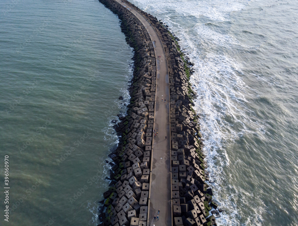 aerial view of a jetty at the entrance of the harbour of Scheveningen aerial view of a jetty at the entrance of the harbour of Scheveningen