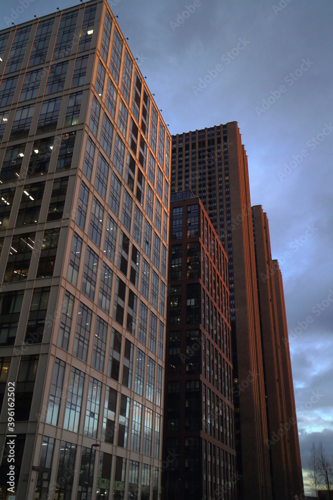 Looking at skyscrapers in the evening. Skyscrapers at sunset. Looking at skyscrapers in the evening. Skyscrapers at sunset.