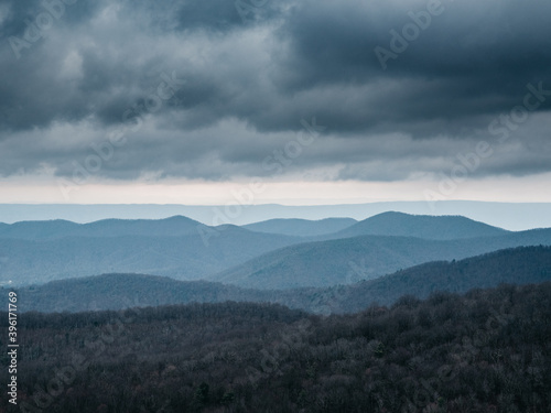 clouds over layers of mountains. View of Blue Ridge Mountains from Skyline Drive on a cold cloudy day in Winter.