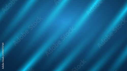Abstract blue background in the form of silk and rays of light.