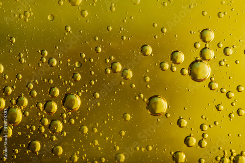  water droplets in oil  macro photo  yellow background