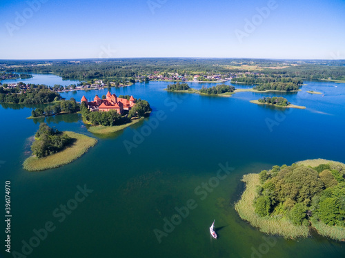Fototapeta Naklejka Na Ścianę i Meble -  Aerial view of beautiful Gothic style red brick castle on an island on Galve Lake, Trakai, Lithuania