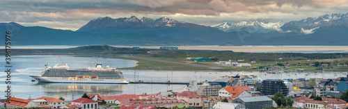 wide angle panorama of Ushauia city with coast line and mountains on horizon