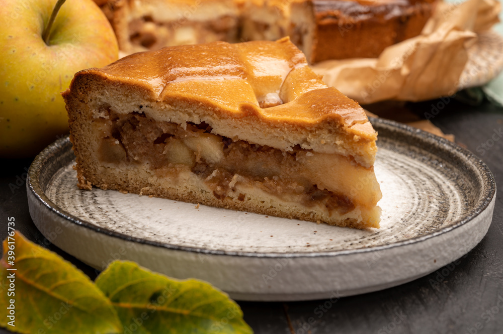 Fresh baked apple cake or pie, filled with sweet apples, raisins and cinnamon