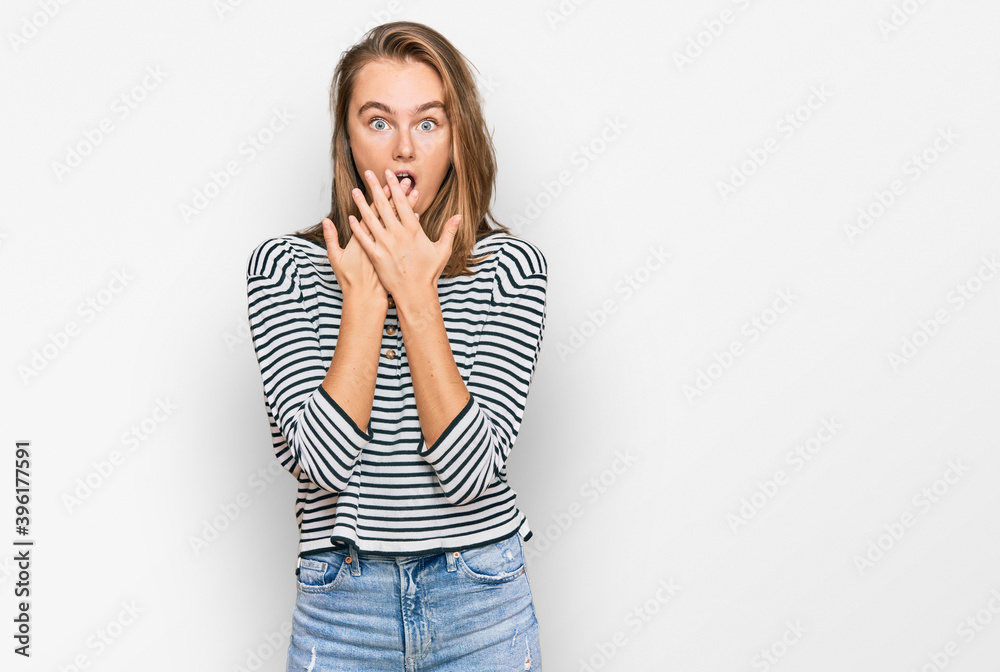 Beautiful blonde woman wearing casual clothes shocked covering mouth with hands for mistake. secret concept. Beautiful blonde woman wearing casual clothes shocked covering mouth with hands for mistake. secret concept.