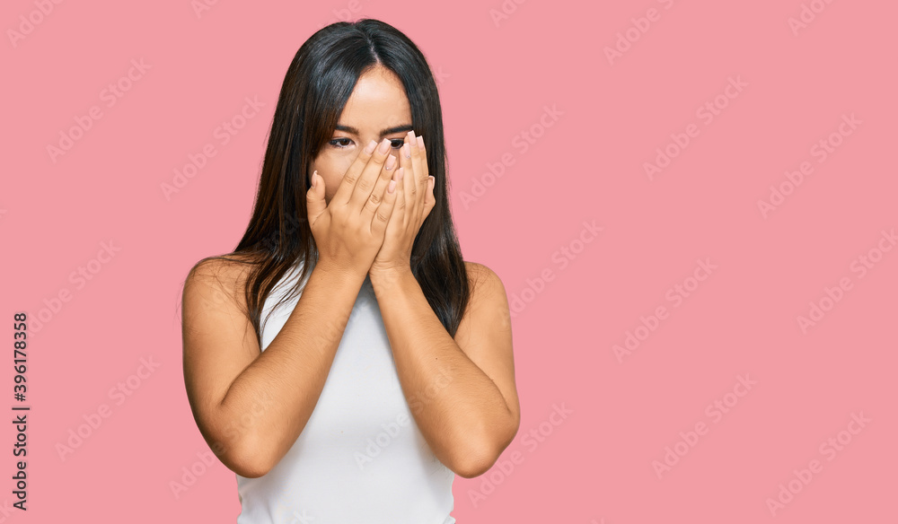 Young beautiful hispanic girl wearing casual clothes with sad expression covering face with hands while crying. depression concept. Young beautiful hispanic girl wearing casual clothes with sad expression covering face with hands while crying. depression concept.