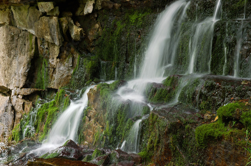 Devils monument waterfall rocks and moss landscape