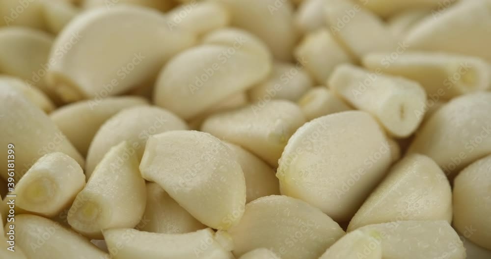 peeled garlic close up rotating peeled garlic close up rotating
