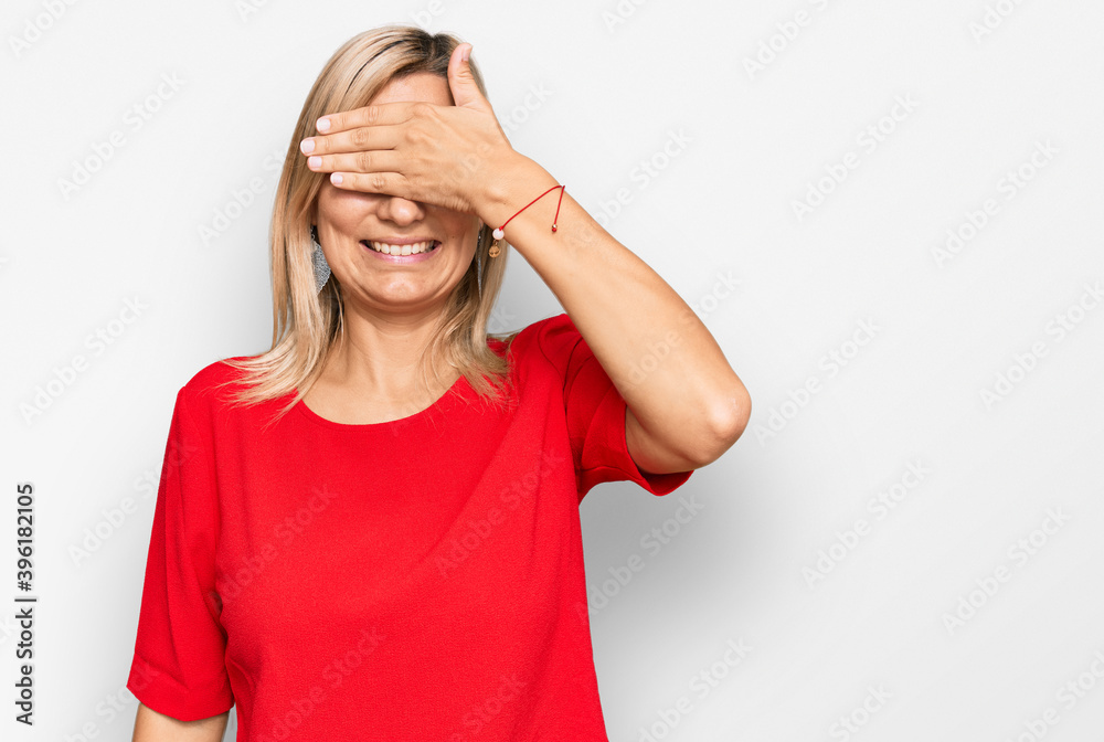 Middle age caucasian woman wearing casual clothes smiling and laughing with hand on face covering eyes for surprise. blind concept.