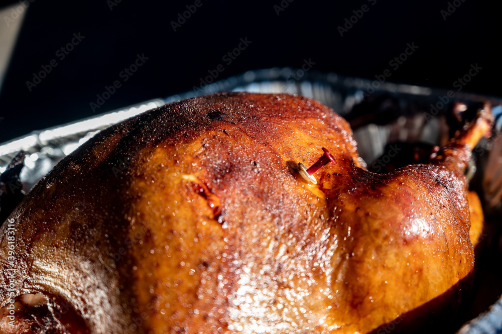 Pop-up thermometer timer in a smoked turkey Stock-Foto | Adobe Stock