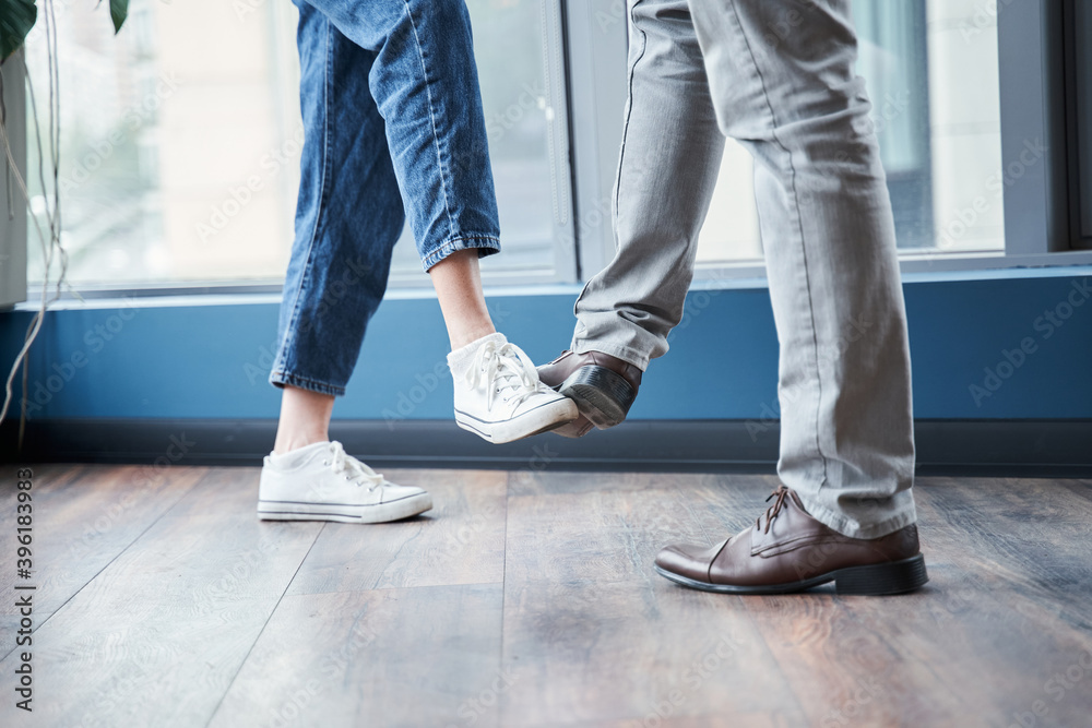 Informal greeting foot bump by business people Informal greeting foot bump by business people