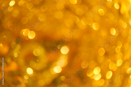 Curly golden bokeh as a trending backdrop. Bokeh in color: set sail champagne, fortuna gold, maricold, illuminating 