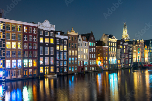 Amsterdam City Center. Beautiful view of Amsterdam Canals with Bridge and typical Dutch Houses. Netherlands.