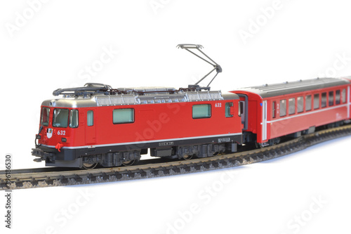 Scale model of red train isolated on white