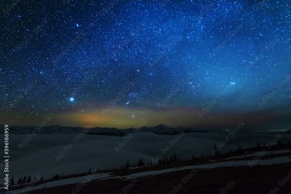 Space starry nights with a bright Milky Way on the backdrop of tourists with tents. Space starry nights with a bright Milky Way on the backdrop of tourists with tents.