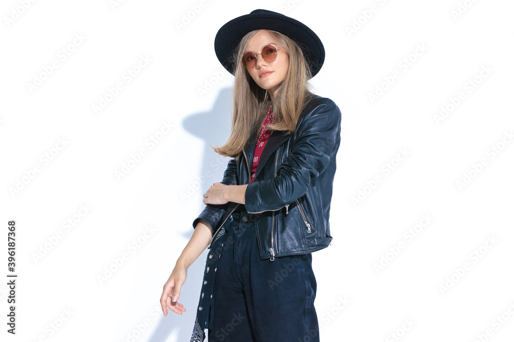 standing cool woman wearing hat and sunglasses standing cool woman wearing hat and sunglasses
