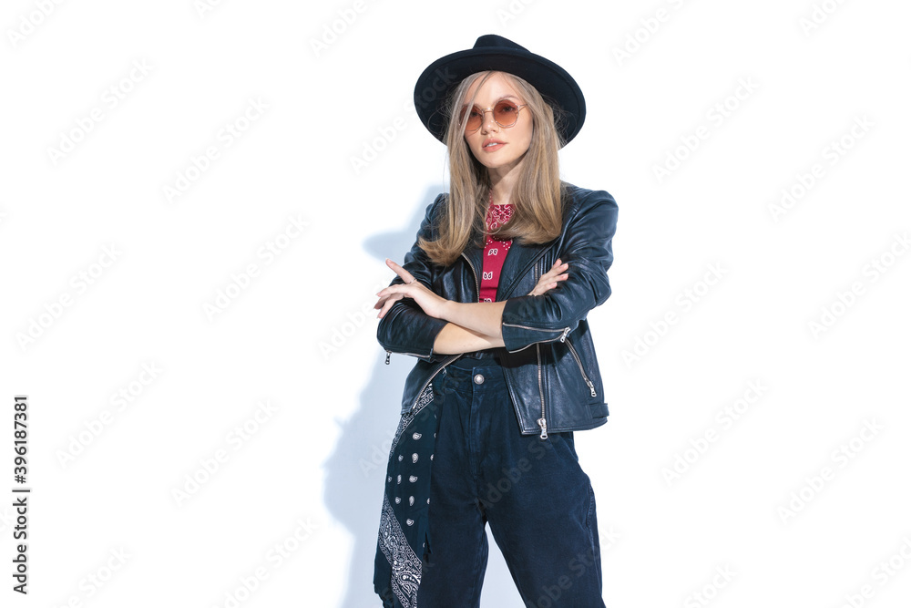 confident casual woman in leather jacket crossing arms confident casual woman in leather jacket crossing arms