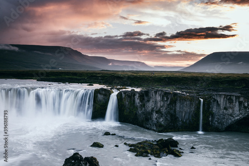 This picture shows the Godafoss in Iceland while a nice sunset takes place. You will enjoy the clear look at the icelandic moody region. The long-exposure of the waterfall  gives it a nice look.