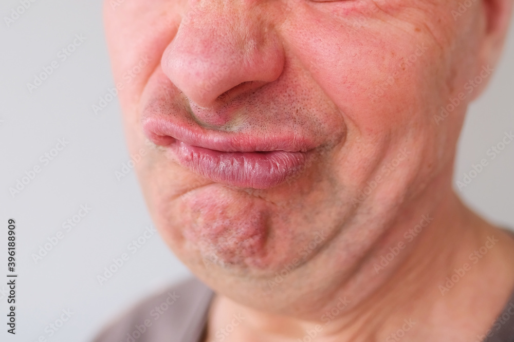 Obraz premium funny face of european adult man close up, wrinkles on aging skin, actor's grimaces, human emotions, mental illness