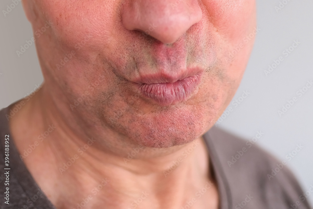 Obraz premium funny face of european adult man close up, wrinkles on aging skin, actor's grimaces, human emotions, mental illness