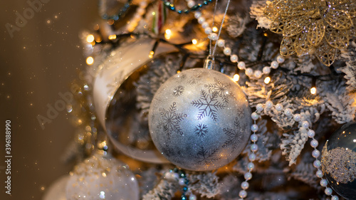Christmas festive background  fir tree with bokeh lights and new year balls. Festive New Year background.
