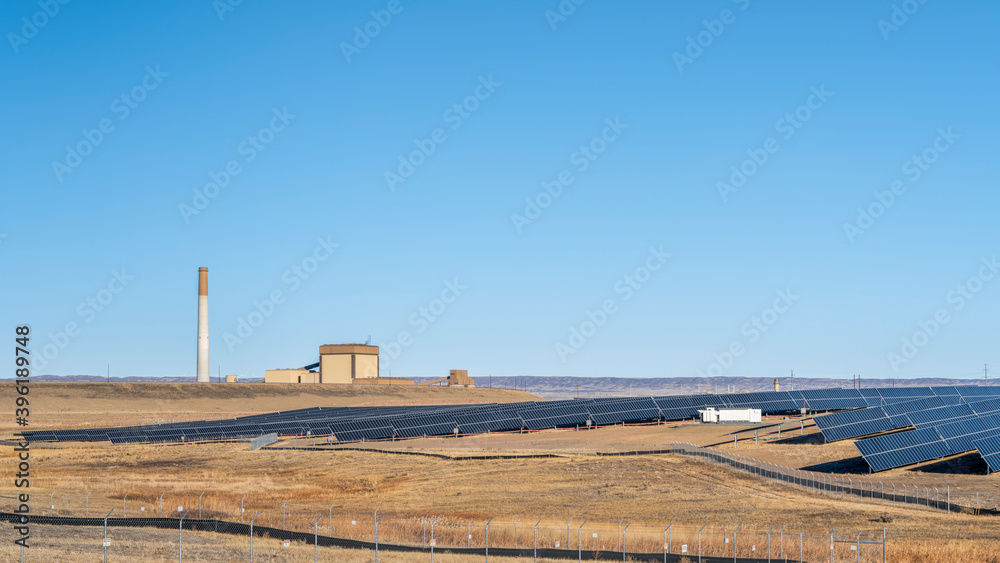 coal and gas power plant and solar farm in northern Colorado - switching from conventional fossil fuel to sustainable energy source