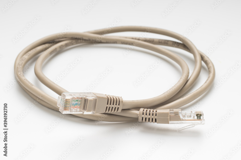 Coiled computer internet cable on white background Coiled computer internet cable on white background