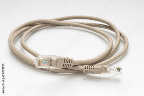 Coiled computer internet cable on white background