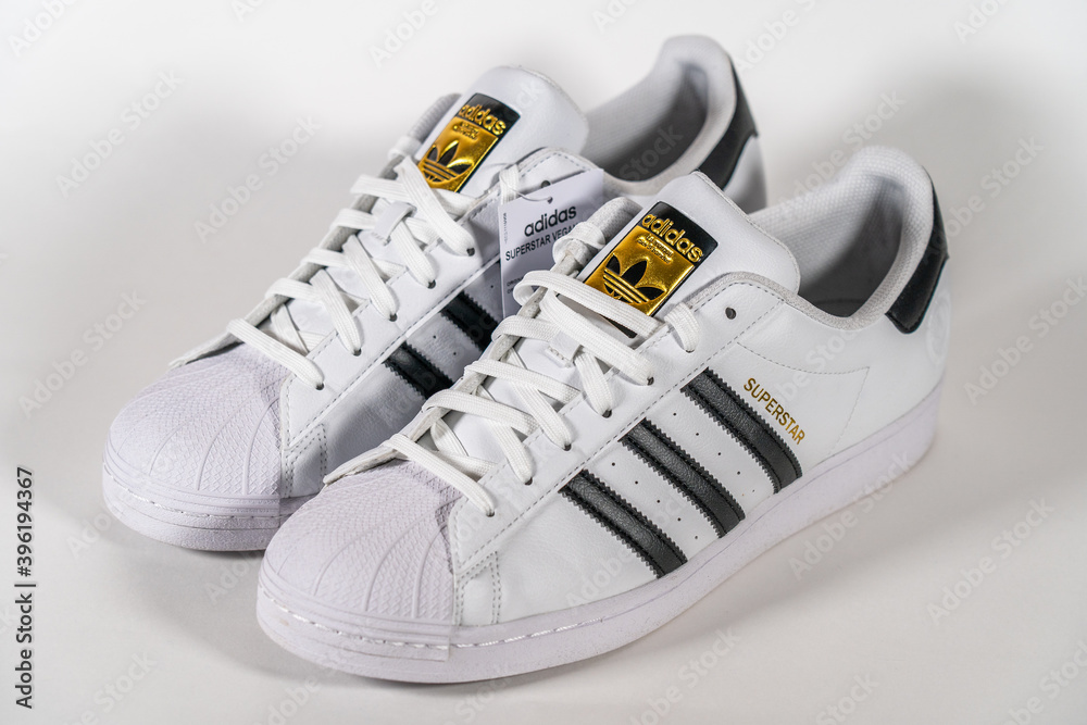 Adidas Superstar - famous sneaker model produced German manufacturer equipment and accessories Adidas. Retro basketball shoe, in production since 1969 - Moscow, Russia - November 2020. Stock | Adobe Stock