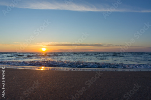 Wallpaper Mural Sunset over the sea. Reflection of sunlight in the sea waves. The sky in the sunset rays. Baltic Sea. Torontodigital.ca