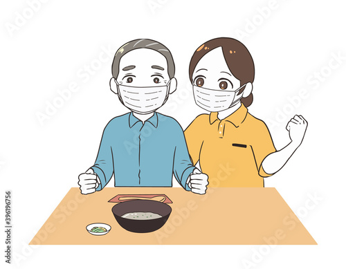 お粥を食べる高齢男性　女性介護士　マスク