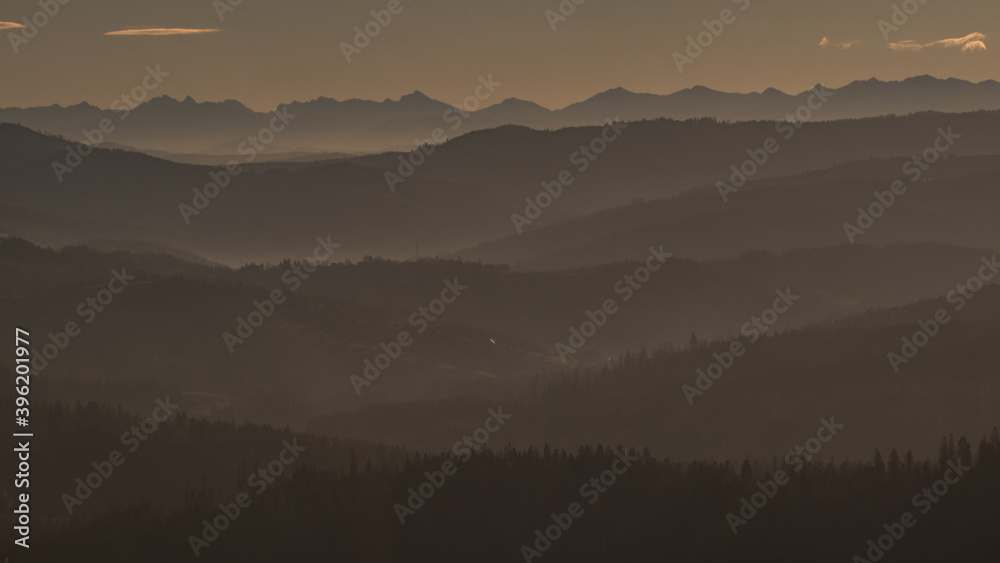 Beautiful sunrise at Ochodzita mountain with a view towards the Beskidy mountains early in cold winter months. Beautiful sunrise at Ochodzita mountain with a view towards the Beskidy mountains early in cold winter months.