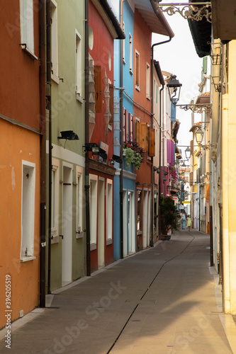 Alleys and streets among the colorful houses of the seaside village of Caorle