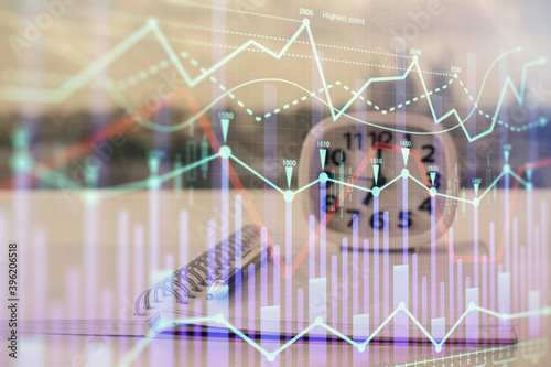 Multi exposure of financial graph drawings and desk with open notebook background. Concept of forex © peshkova