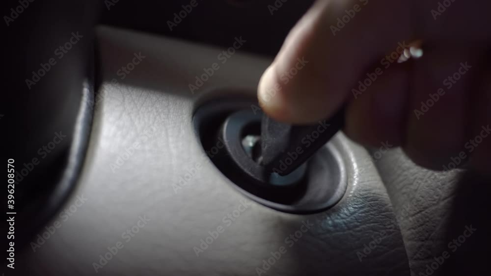 The driver inserts the ignition key into the ignition lock, turns it