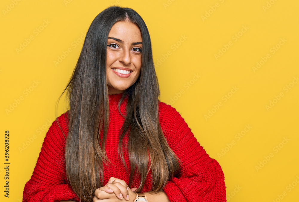 Beautiful hispanic woman wearing casual clothes with hands together and crossed fingers smiling relaxed and cheerful. success and optimistic Beautiful hispanic woman wearing casual clothes with hands together and crossed fingers smiling relaxed and cheerful. success and optimistic
