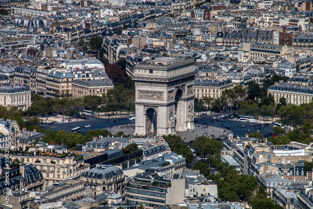 Aerial view of Paris with the Arc de Triomphe in the center of the image