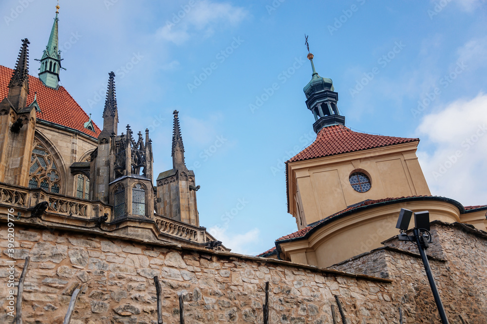 Medieval stone St. Bartholomew´s Church in Kolin, Gothic Cathedral and baroque building of Ossuary in autumn day, arched windows, chimeras, Central Bohemia, Czech republic