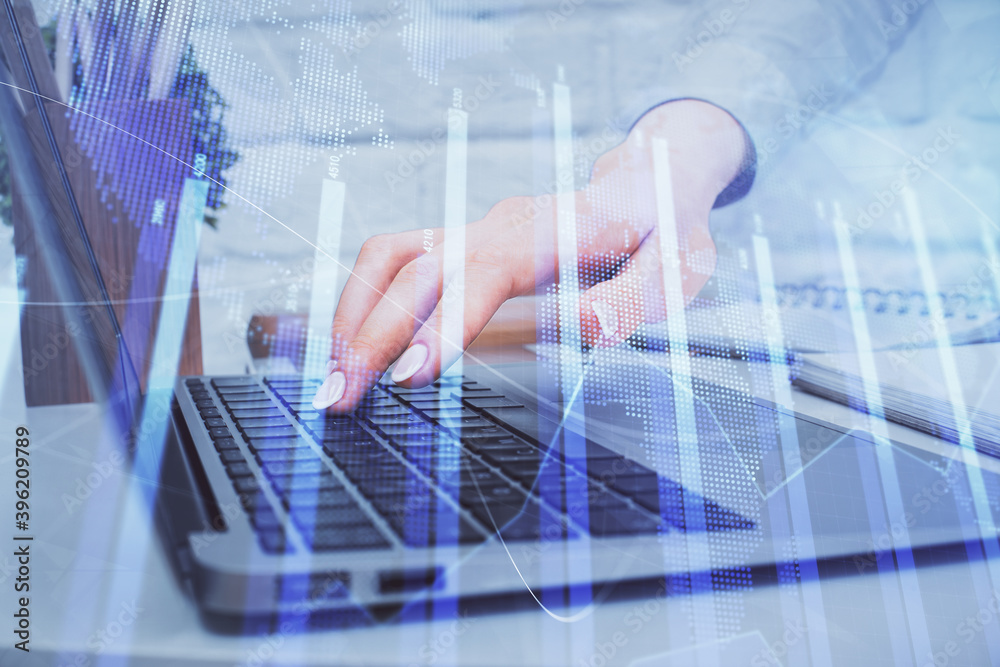 Multi exposure of woman hands typing on computer and forex chart hologram drawing. Stock market analysis concept. Multi exposure of woman hands typing on computer and forex chart hologram drawing. Stock market analysis concept.
