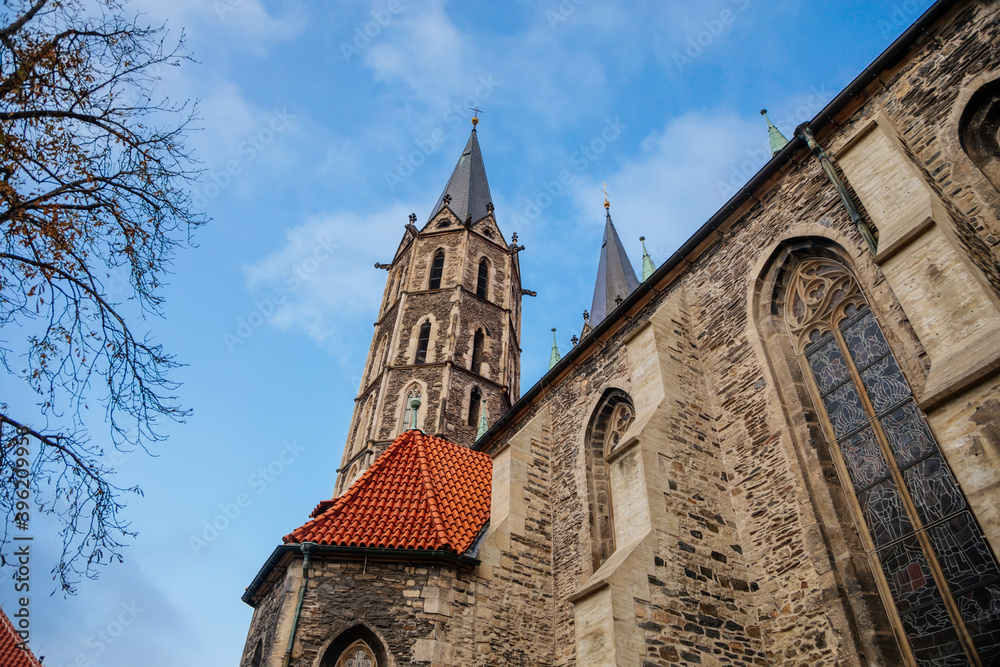 Medieval stone St. Bartholomew´s Church in autumn day, arched windows, chimeras and gargoyles, Gothic Cathedral with belfry in Kolin, Central Bohemia, Czech republic