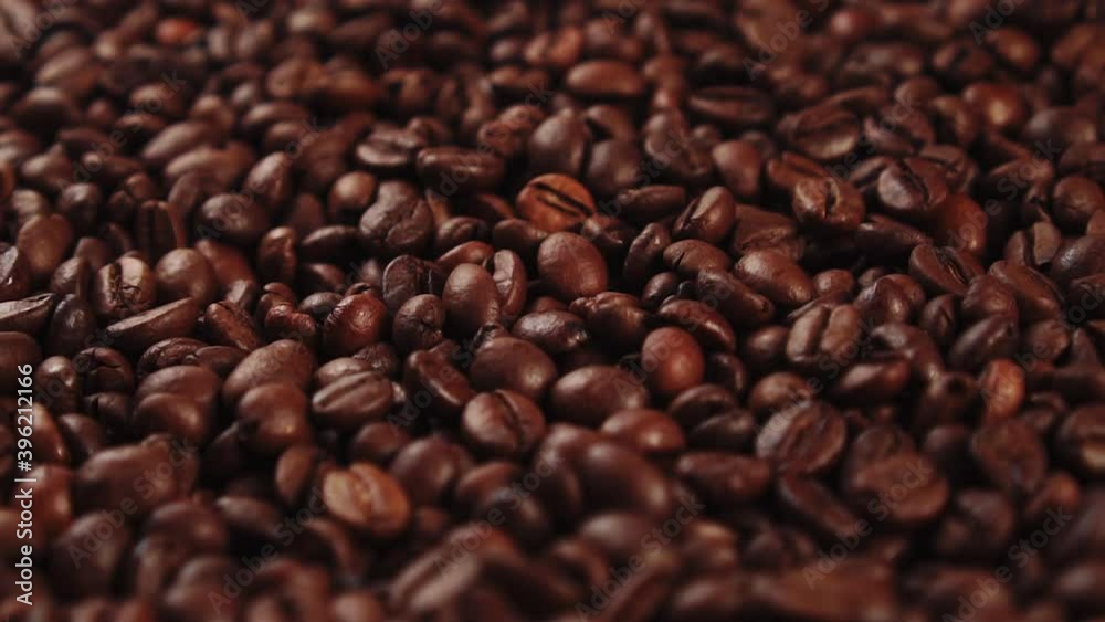 Dark Roasted Coffee Grains. Rotating. Coffee beans Closeup. Beautiful brown seeds. Dark Roasted Coffee Grains. Rotating. Coffee beans Closeup. Beautiful brown seeds.