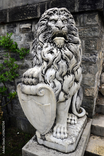 Sinaia, Romania, May 15, 2019: Lion sculpture near Peles castle. photo