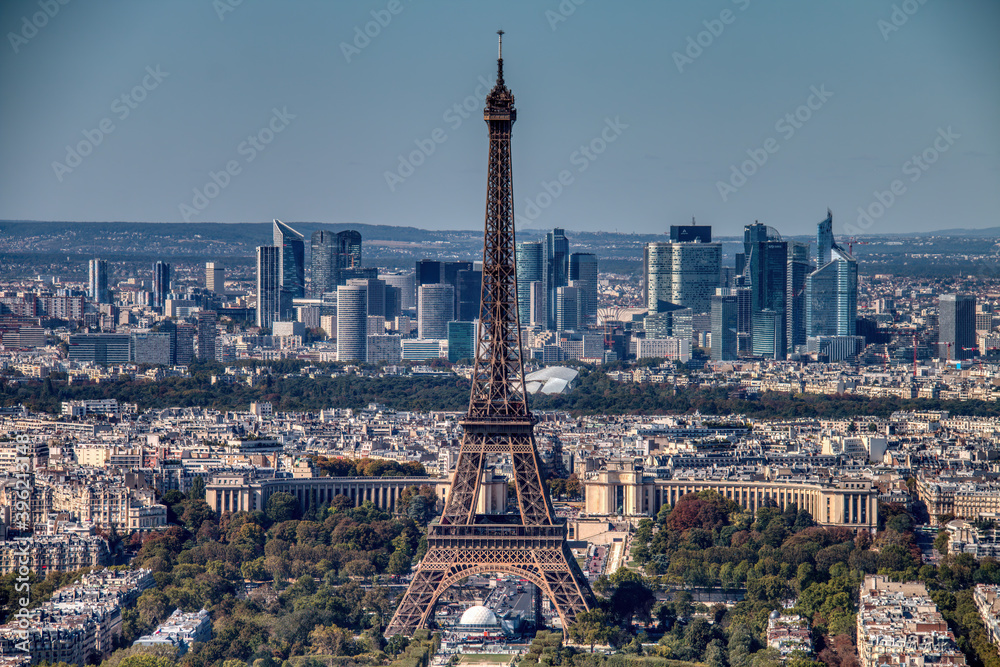 Aerial view of Paris with the Eiffel tower in the center of the image.
