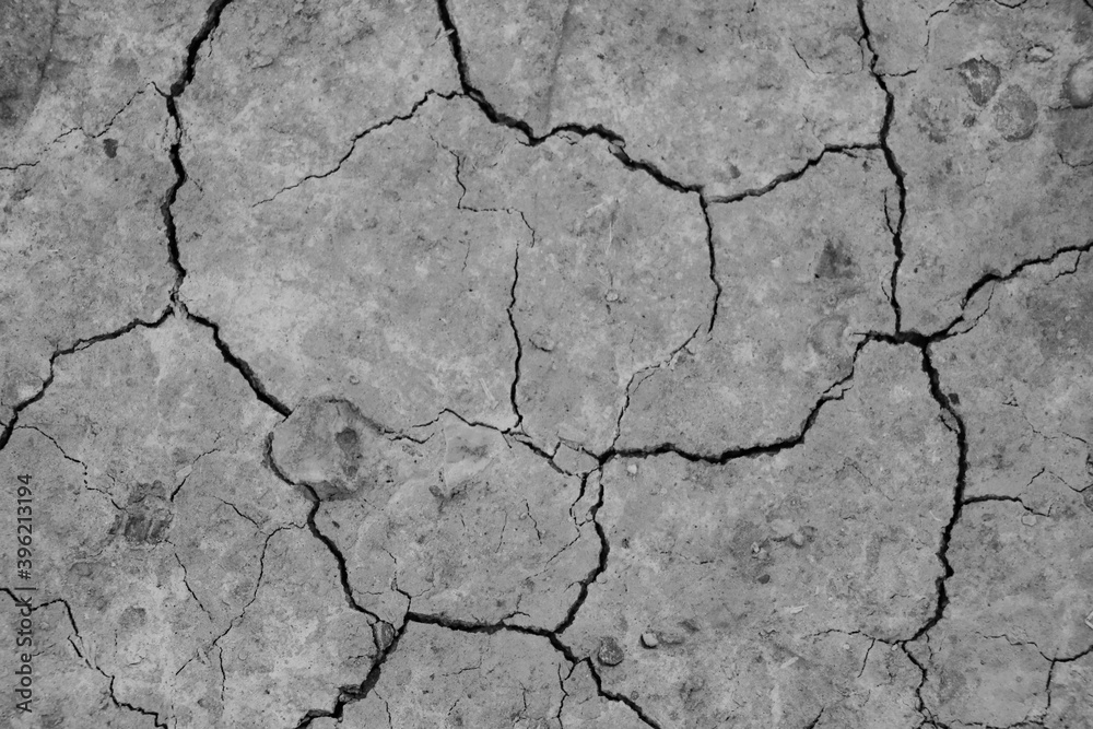 Close-up top view of a cracked part of the earth from a mud volcano, background, out of focus, blank for designers, selective focus. Close-up top view of a cracked part of the earth from a mud volcano, background, out of focus, blank for designers, selective focus.