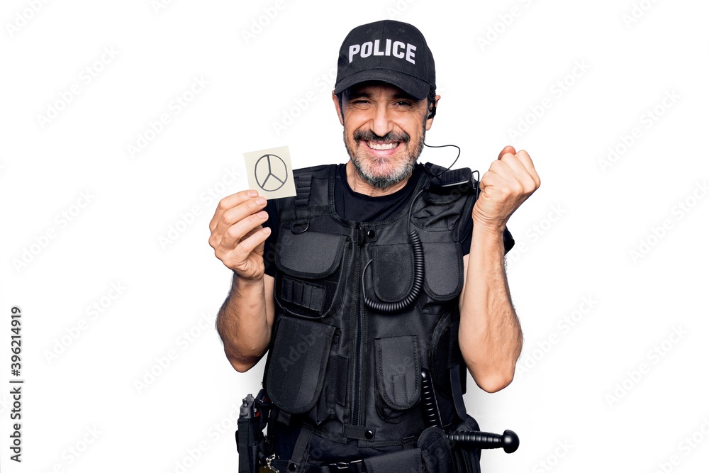 Middle age policeman wearing police uniform holding reminder paper with peace symbol screaming proud, celebrating victory and success very excited with raised arm Middle age policeman wearing police uniform holding reminder paper with peace symbol screaming proud, celebrating victory and success very excited with raised arm