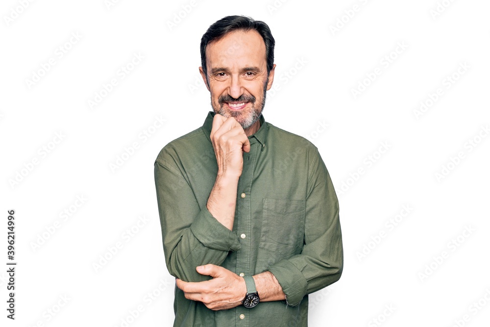 Middle age handsome man wearing casual green shirt over isolated white background smiling looking confident at the camera with crossed arms and hand on chin. Thinking positive. Middle age handsome man wearing casual green shirt over isolated white background smiling looking confident at the camera with crossed arms and hand on chin. Thinking positive.