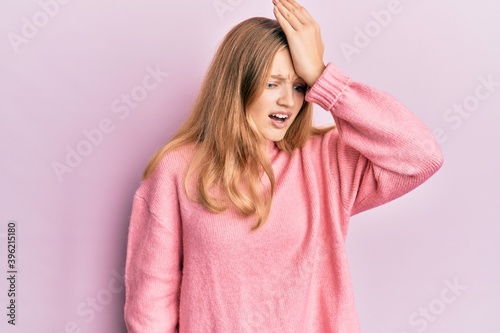Beautiful young caucasian girl wearing casual clothes surprised with hand on head for mistake, remember error. forgot, bad memory concept. © Krakenimages.com